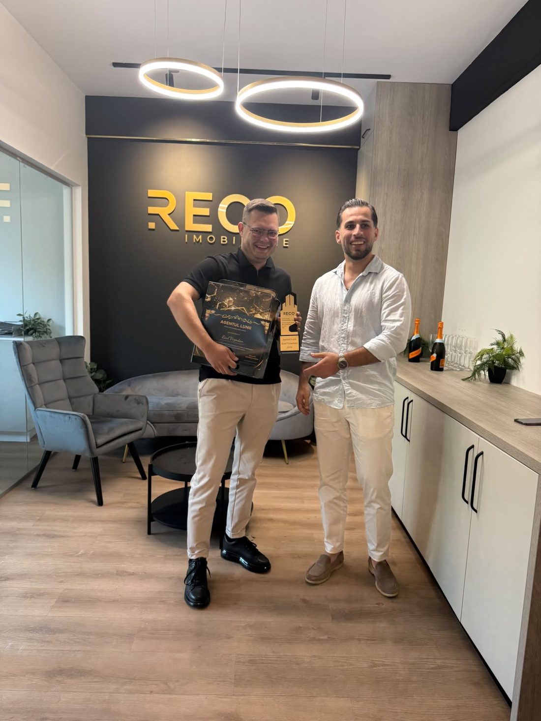 Raul receiving the Agent of the Month award